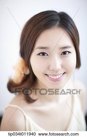 close up shot of a lady with a flower pin on the hair View Large Photo Image Stock Image - close up shot of a lady with a flower pin on the hair. Fotosearch