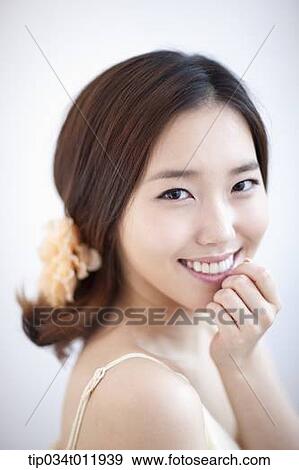 close up shot of a lady with a flower pin on the hair View Large Photo Image Stock Photo - close up shot of a lady with a flower pin on the hair. Fotosearch