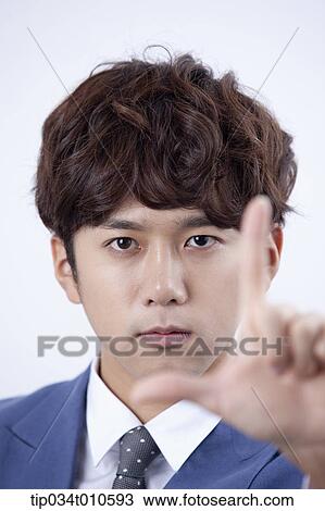 Stock Image - close up shot of a man with hand gesture. Fotosearch