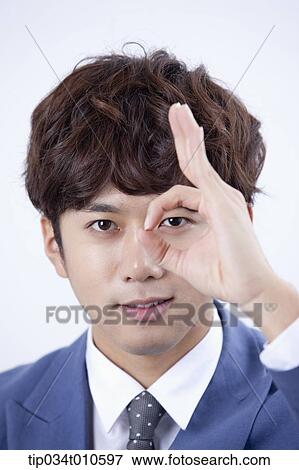 Stock Photo - close up shot of a man with hand gesture. Fotosearch