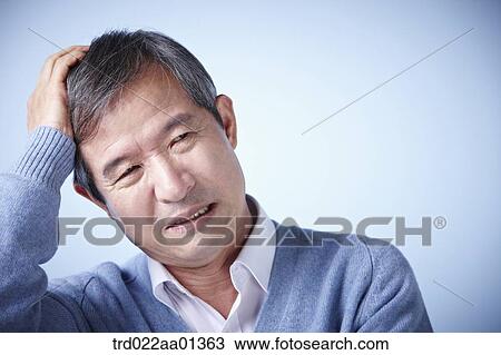 close up shot of a middle aged man frowning View Large Photo Image Stock Image - close up shot of a middle aged man frowning. Fotosearch