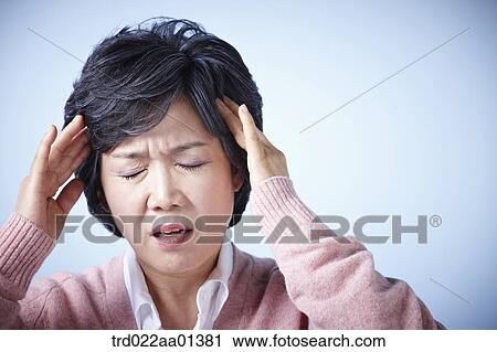 close up shot of a middle aged woman frowning View Large Photo Image Stock Image - close up shot of a middle aged woman frowning. Fotosearch