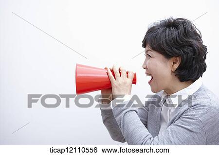 Stock Photograph - close up shot of a mother scolding with megaphone. Fotosearch