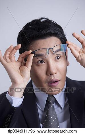 Stock Photography - close up shot of businessman with glasses. Fotosearch