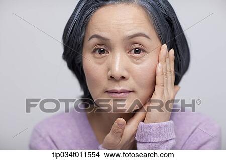 Picture - close up shot of middle aged woman . Fotosearch