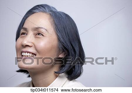 close up shot of middle aged woman smiling View Large Photo Image Picture - close up shot of middle aged woman smiling. Fotosearch