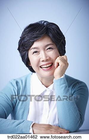 close up shot of middle aged woman smiling View Large Photo Image Stock Image - close up shot of middle aged woman smiling. Fotosearch