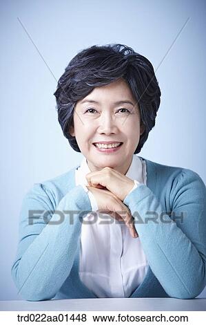 close up shot of middle aged woman smiling View Large Photo Image Stock Photo - close up shot of middle aged woman smiling. Fotosearch