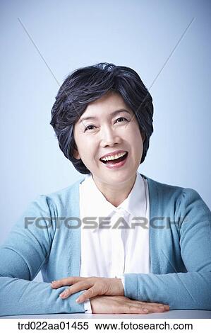 Stock Photography - close up shot of middle aged woman smiling. Fotosearch