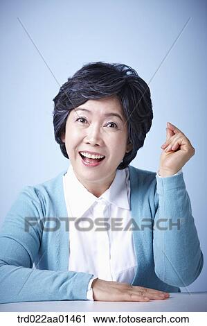 close up shot of middle aged woman with an idea View Large Photo Image Stock Image - close up shot of middle aged woman with an idea. Fotosearch