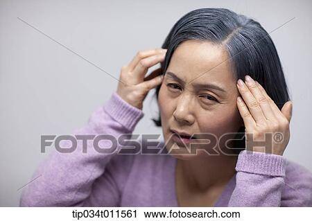 close up shot of stressed middle aged woman View Large Photo Image Stock Image - close up shot of stressed middle aged woman . Fotosearch