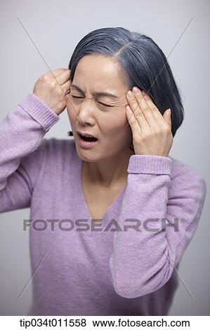 close up shot of stressed middle aged woman View Large Photo Image Stock Photo - close up shot of stressed middle aged woman . Fotosearch