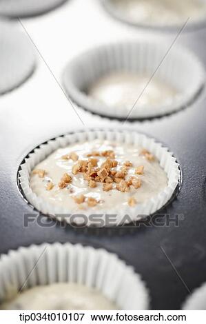 Stock Photo - cupcakes on oven tray. Fotosearch