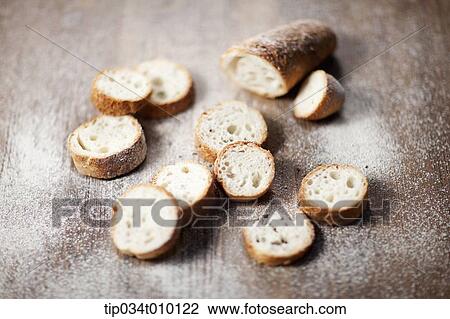 cut baguette with powder View Large Photo Image Stock Image - cut baguette with powder. Fotosearch