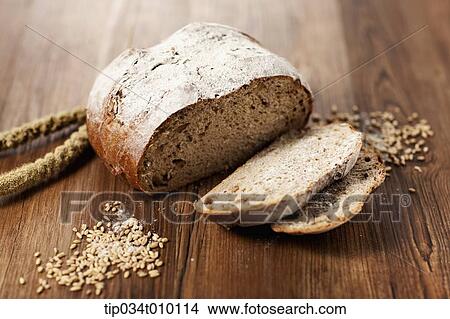 Picture - cut bread on a cutting board. Fotosearch