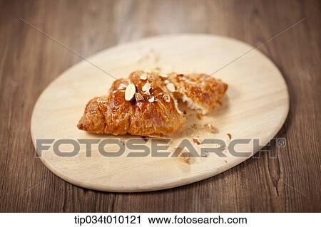Stock Image - cut bread on a cutting board. Fotosearch