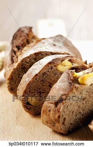 Stock Photo - cut bread on a cutting board. Fotosearch