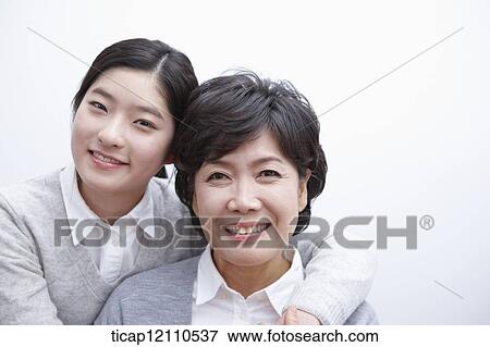 Stock Photo - daughter hugging mother. Fotosearch