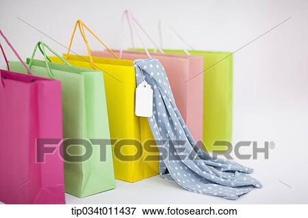 Stock Photo - different color shopping bags. Fotosearch
