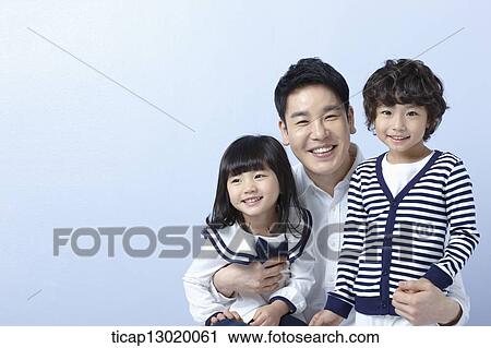 Stock Image - father hugging kids. Fotosearch