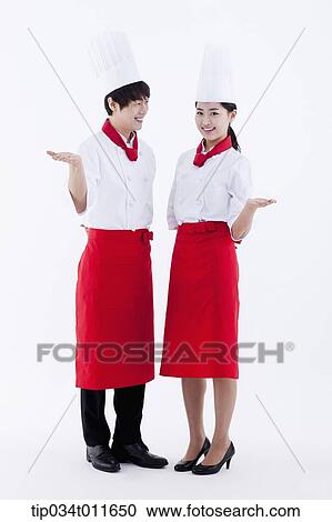 female and male cook in red apron posing View Large Photo Image Stock Image - female and male cook in red apron posing. Fotosearch