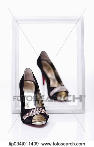 heels stepping out of a frame View Large Photo Image Stock Photo - heels stepping out of a frame. Fotosearch