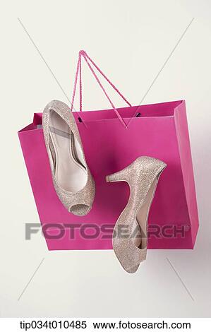 Stock Photography - high heels in pink bag . Fotosearch