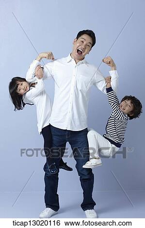 Stock Photograph - kids hanging in their fathers arms. Fotosearch
