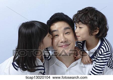 Picture - kids hugging their father. Fotosearch