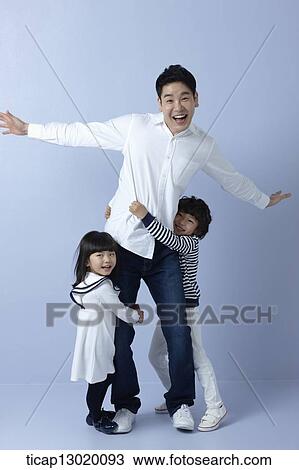 Stock Image - kids hugging their father. Fotosearch