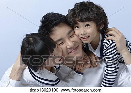 kids hugging their father View Large Photo Image Stock Image - kids hugging their father. Fotosearch