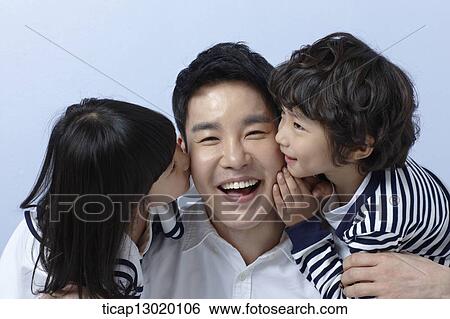 Stock Photograph - kids hugging their father. Fotosearch