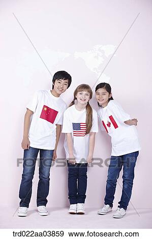 Stock Photo - kids with Chinese, American and Canadian flags on their t-shirts. Fotosearch