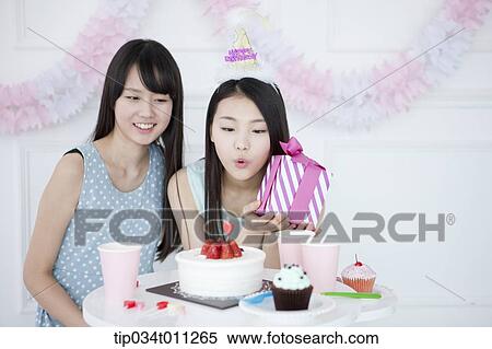 Stock Photography - ladies having birthday party. Fotosearch