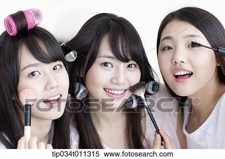 Stock Photography - ladies posing with hair and beauty equipment. Fotosearch