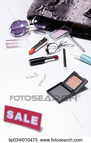Stock Image - make up items with sale tag. Fotosearch