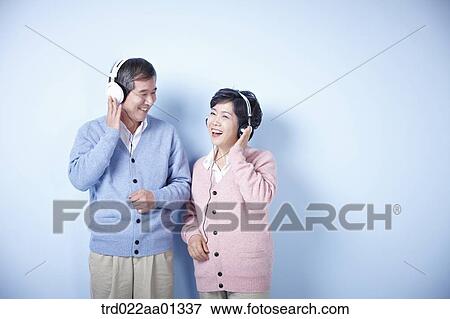 middle aged couple listening to music together View Large Photo Image Stock Photo - middle aged couple listening to music together. Fotosearch