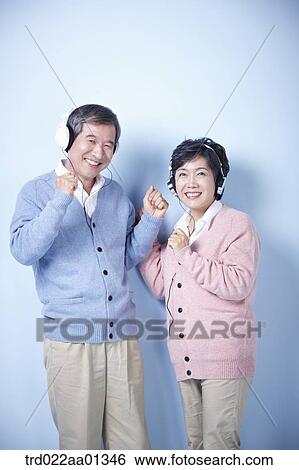 middle aged couple listening to music together View Large Photo Image Stock Photograph - middle aged couple listening to music together. Fotosearch
