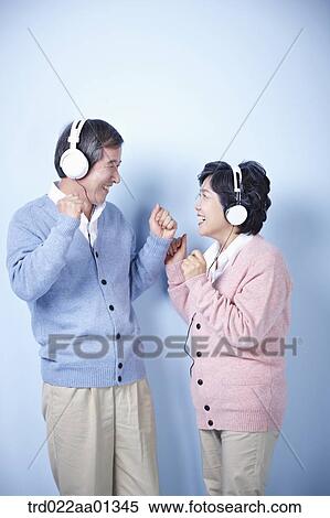 middle aged couple listening to music together View Large Photo Image Stock Photography - middle aged couple listening to music together. Fotosearch