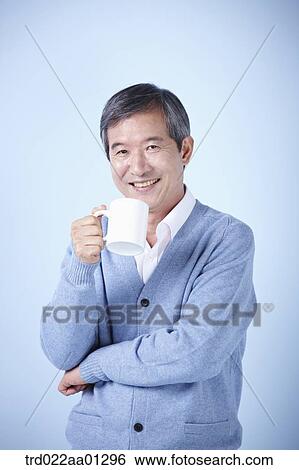 middle aged man drinking cup of coffee View Large Photo Image Stock Photograph - middle aged man drinking cup of coffee. Fotosearch