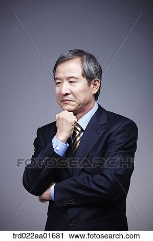 middle aged man in a business suit thinking View Large Photo Image Stock Image - middle aged man in a business suit thinking. Fotosearch