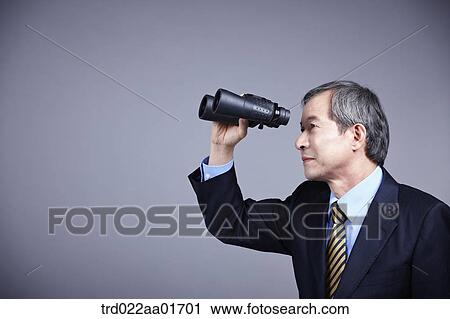 middle aged man in a business suit with telescope View Large Photo Image Stock Image - middle aged man in a business suit with telescope. Fotosearch