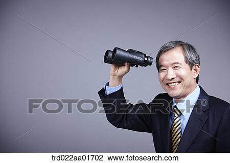 middle aged man in a business suit with telescope View Large Photo Image Stock Image - middle aged man in a business suit with telescope. Fotosearch
