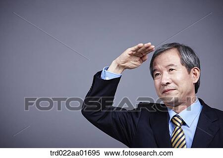 middle aged man in a business suit with salute sign View Large Photo Image Stock Photography - middle aged man in a business suit with salute sign. Fotosearch