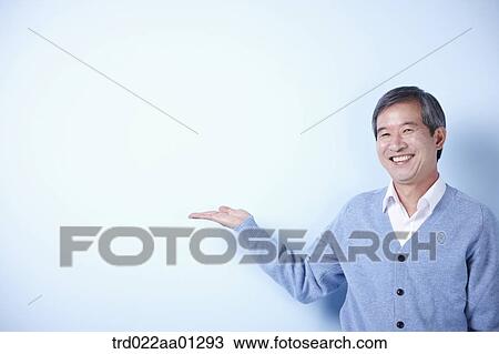 middle aged man on blue background View Large Photo Image Stock Image - middle aged man on blue background. Fotosearch