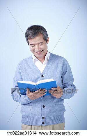 middle aged man reading a book View Large Photo Image Picture - middle aged man reading a book. Fotosearch