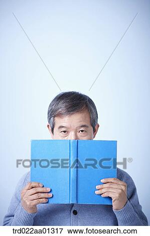middle aged man reading a book View Large Photo Image Stock Photo - middle aged man reading a book. Fotosearch