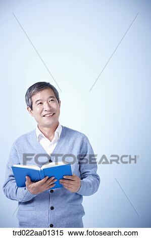 middle aged man reading a book View Large Photo Image Stock Photography - middle aged man reading a book. Fotosearch