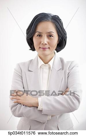 middle aged woman standing with arms crossed View Large Photo Image Stock Photograph - middle aged woman standing with arms crossed. Fotosearch