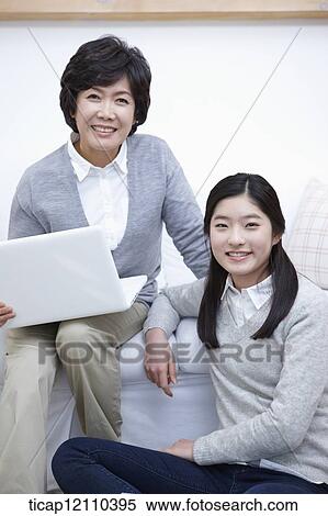 mother and daughter using smart devices View Large Photo Image Stock Photography - mother and daughter using smart devices. Fotosearch